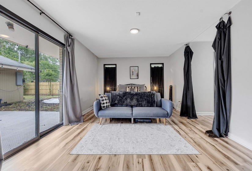 Living room featuring baseboards and light wood-style flooring