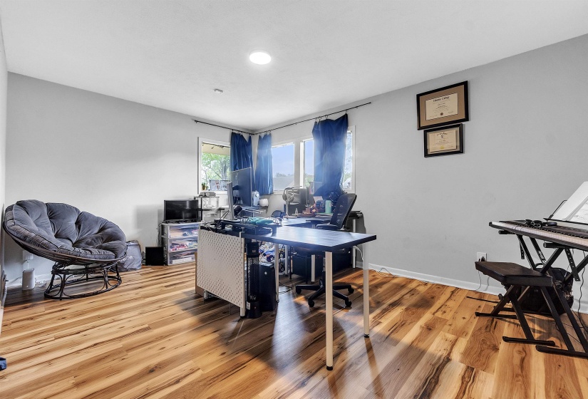 Office with recessed lighting, baseboards, and wood finished floors