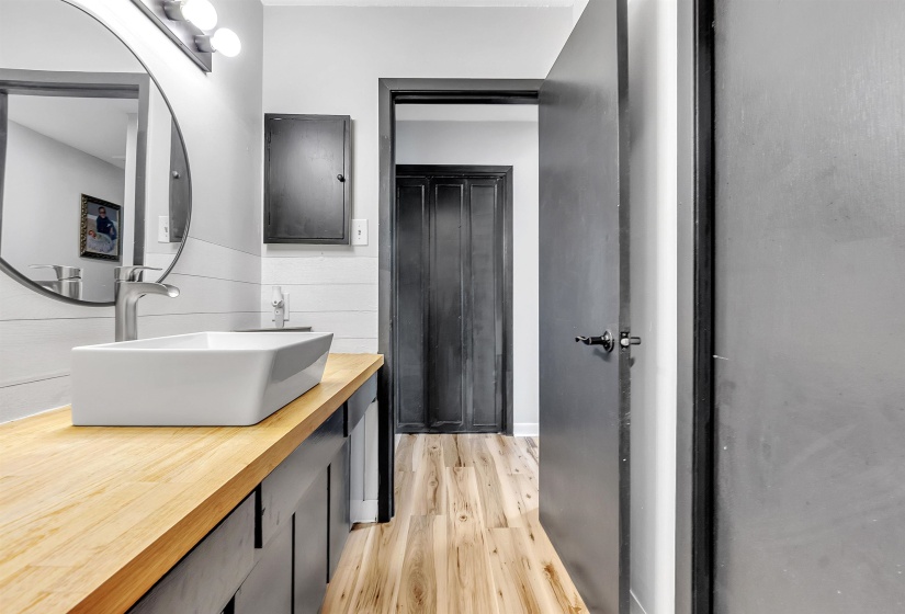Bathroom featuring wood finished floors and vanity