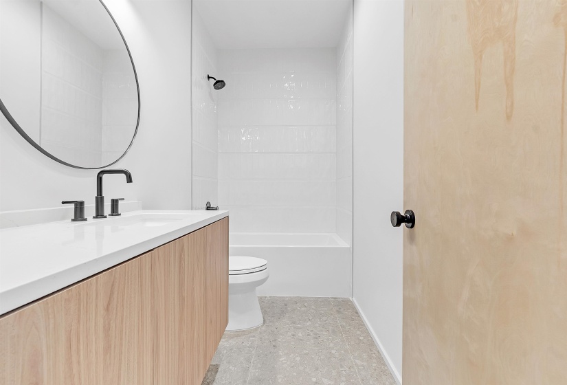 Bathroom with vanity, toilet, and shower / bathtub combination
