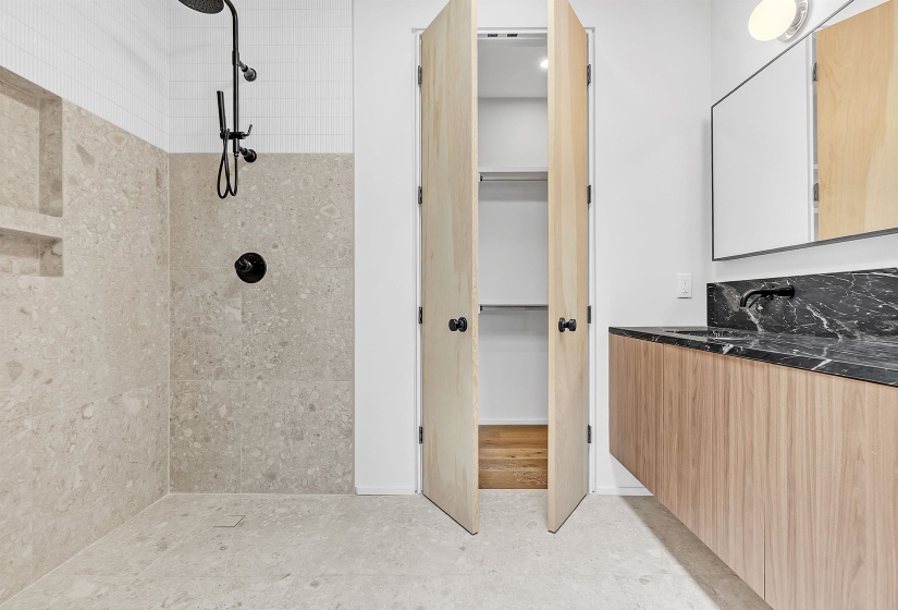 Full bathroom with tiled shower and vanity