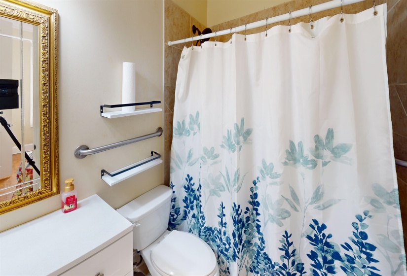 Full bath with a shower with shower curtain and vanity