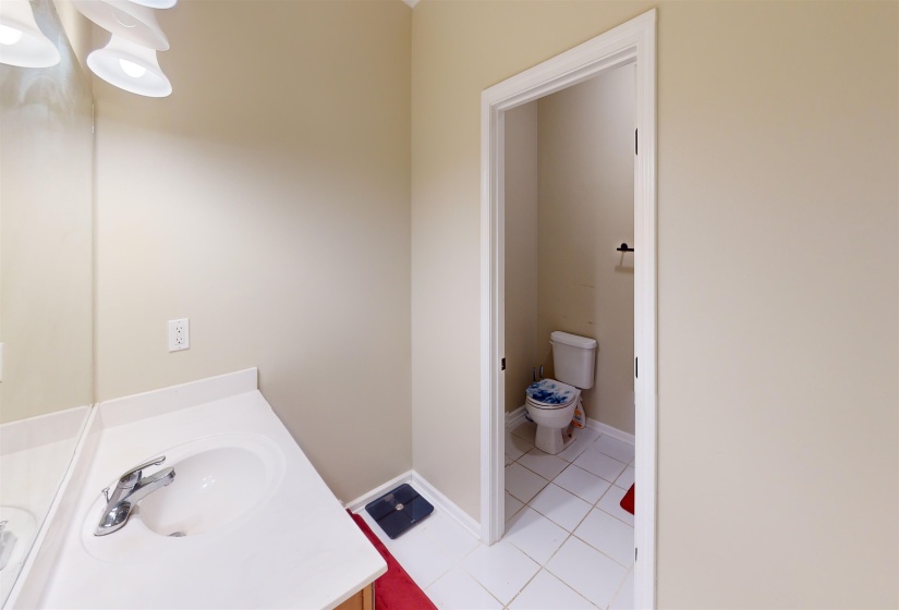 Bathroom featuring light tile patterned flooring and vanity
