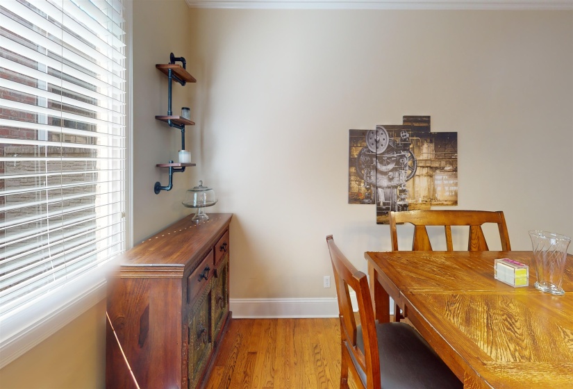 Dining area with healthy amount of natural light and wood finished floors
