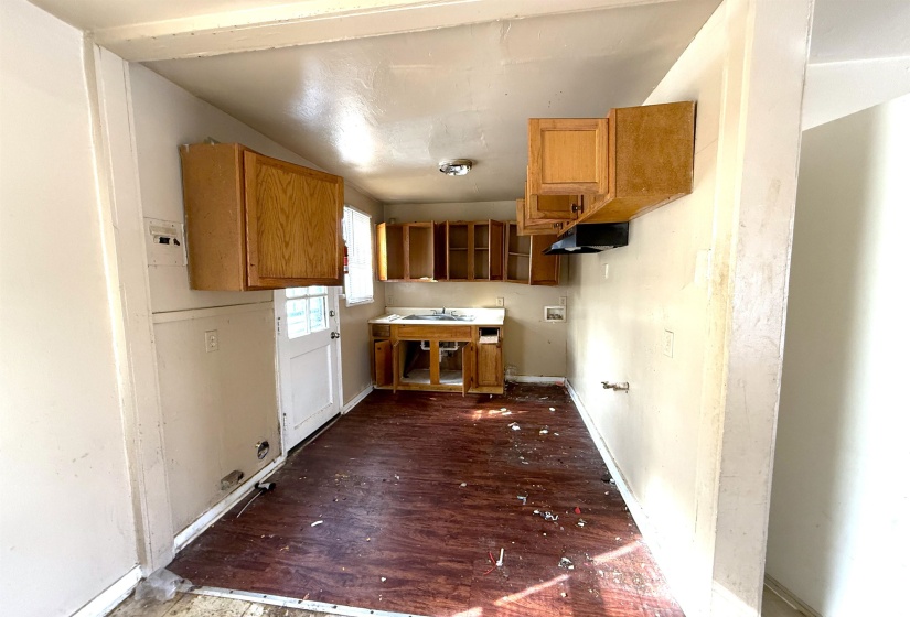 Kitchen featuring wood finish cabinetry and dark wood-style flooring