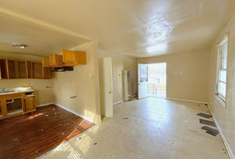 Kitchen with wood finish cabinets and baseboards
