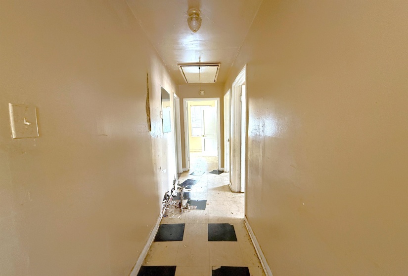 Hallway featuring baseboards