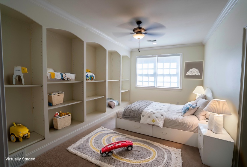 Carpeted bedroom with visible vents, crown molding, and a ceiling fan