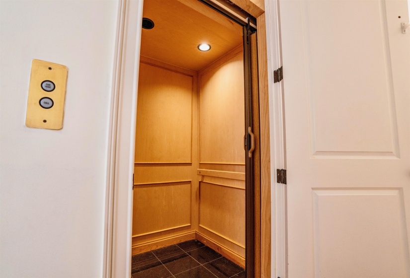 Interior details featuring tile patterned flooring and elevator