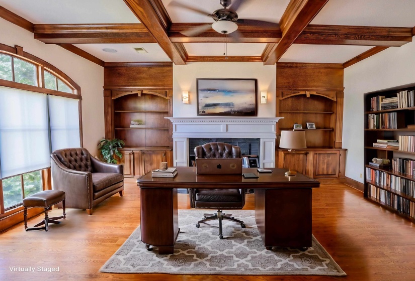 Home office with plenty of natural light, wood finished floors, and ceiling fan