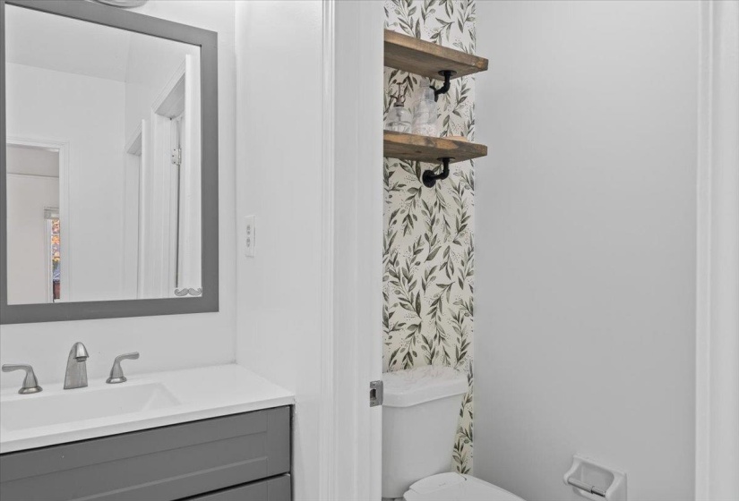 Half bath with toilet and vanity