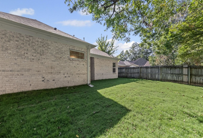 View of fenced backyard