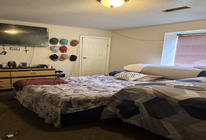 Bedroom featuring a textured ceiling