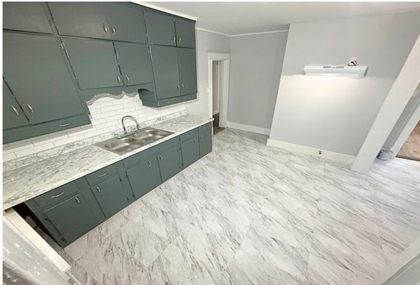 Bathroom with baseboards and backsplash