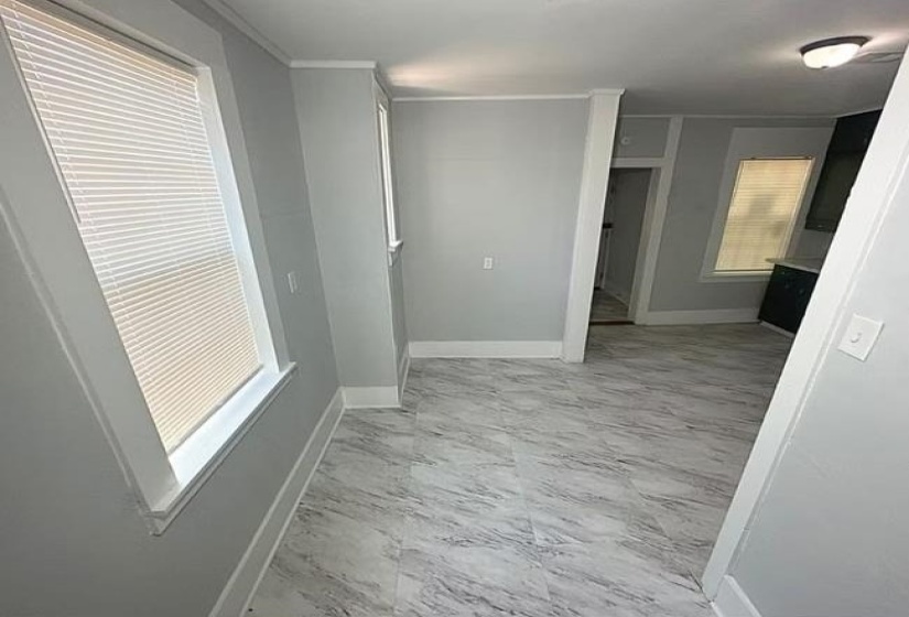 Hallway featuring baseboards