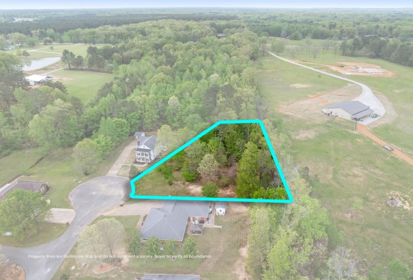 View of property location featuring property parcel outlined and a heavily wooded area