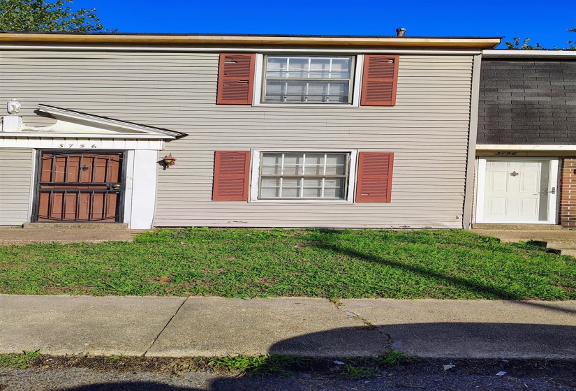 View of front of property with a front yard