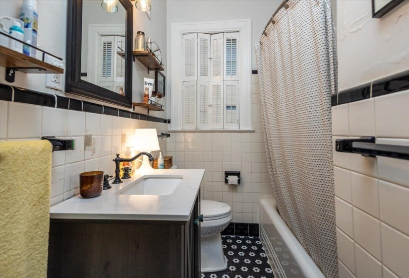 Located between bedroom 1 and bedroom 2
