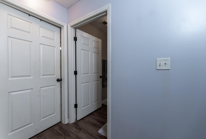 Corridor with dark wood finished floors
