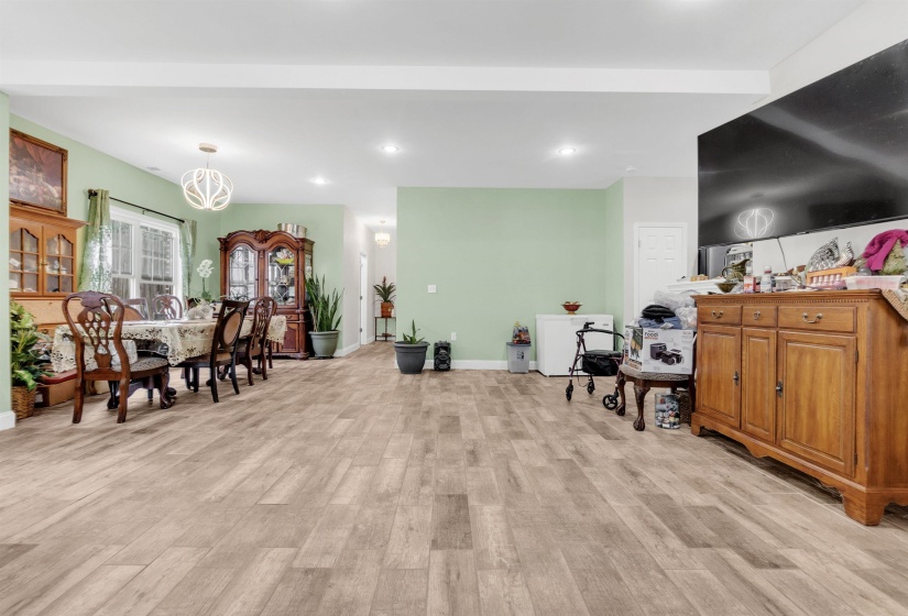 Dining room featuring light wood-type flooring and recessed lighting