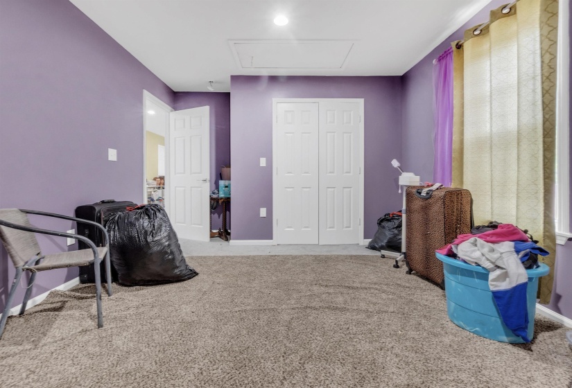 Recreation room featuring light colored carpet and baseboards