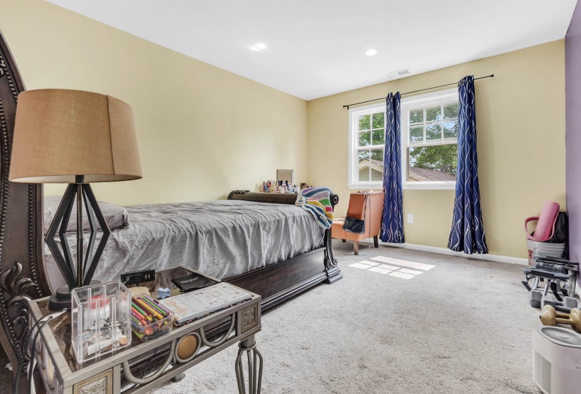Bedroom featuring light colored carpet and recessed lighting