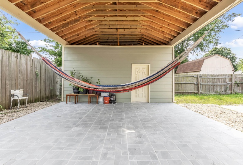 Fenced backyard with a patio