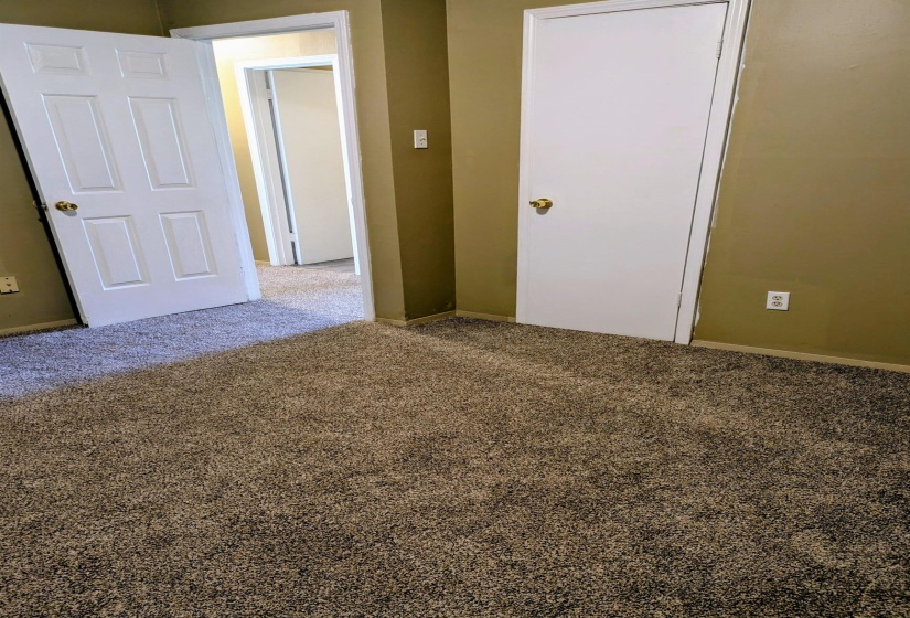Unfurnished bedroom with carpet flooring