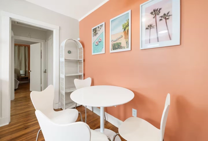Dining space featuring wood finished floors and baseboards