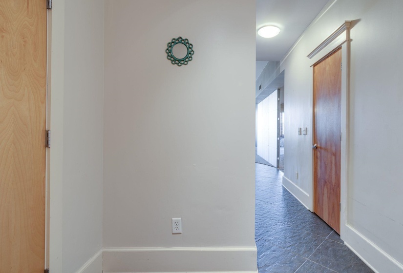 Hall featuring baseboards