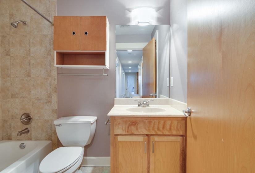Full bathroom featuring vanity and bathing tub / shower combination