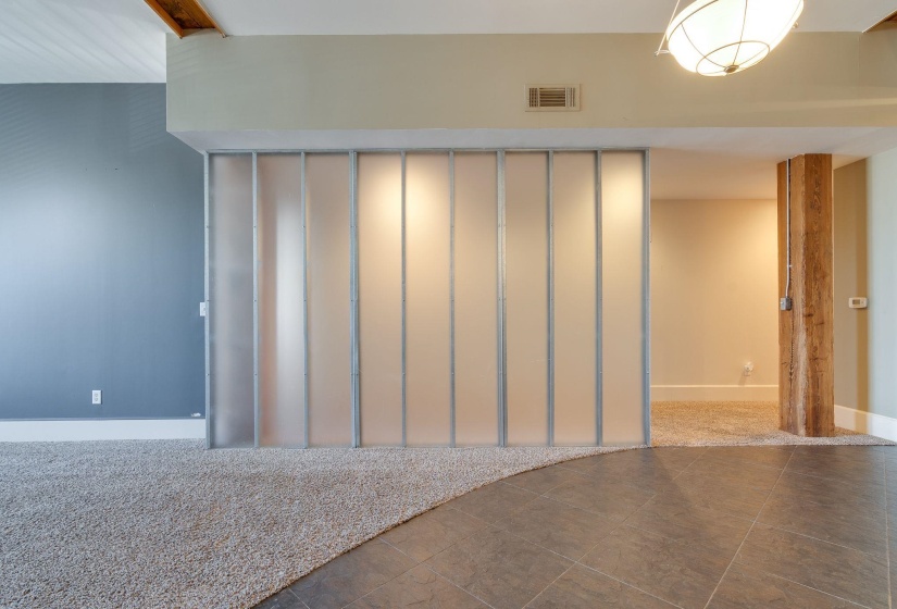 Tiled empty room featuring carpet flooring