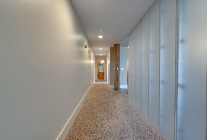 Hall featuring recessed lighting and light colored carpet