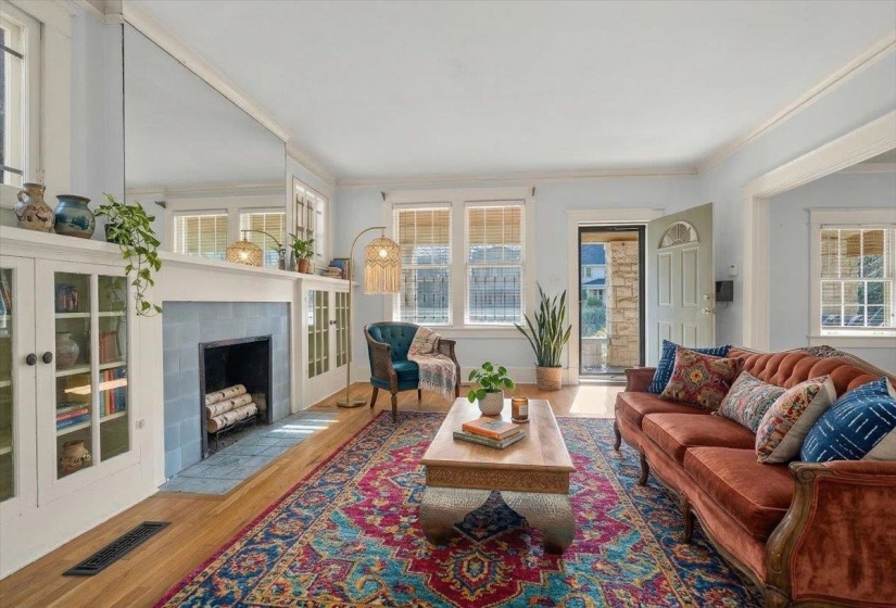 Original fireplace with built-in glass cabinets