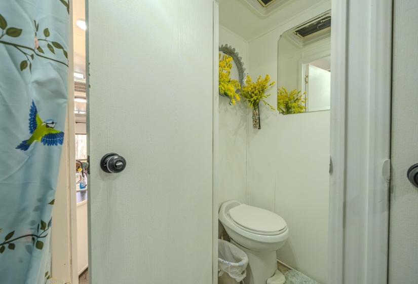 Bathroom featuring a shower with shower curtain and crown molding