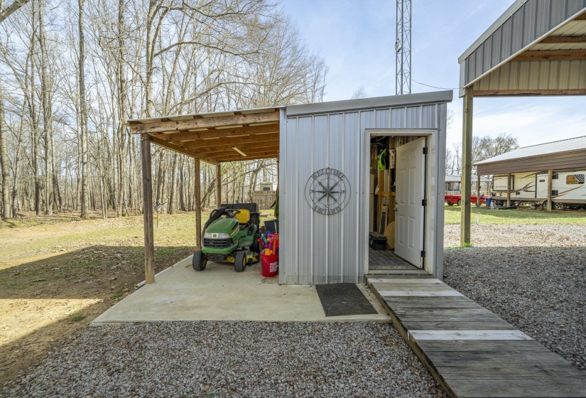 View of outdoor structure with a carport