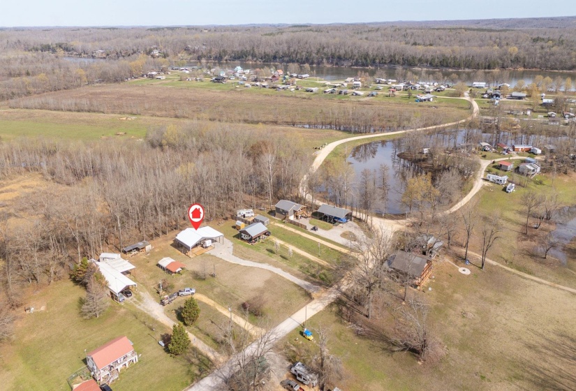 Aerial view of property's location with a forest