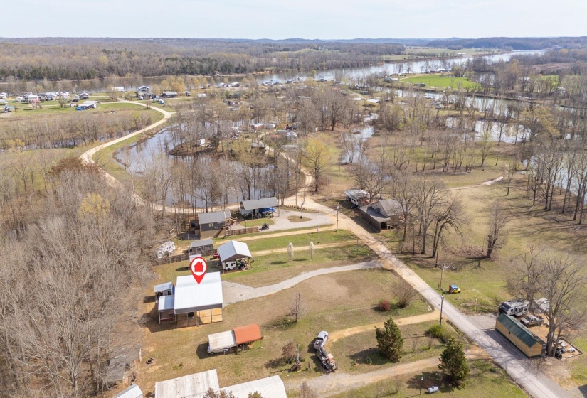 Aerial view of property's location featuring a nearby body of water