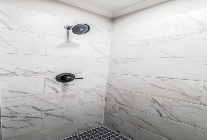 Bathroom featuring tiled shower