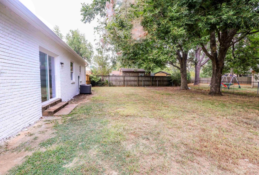 View of fenced backyard