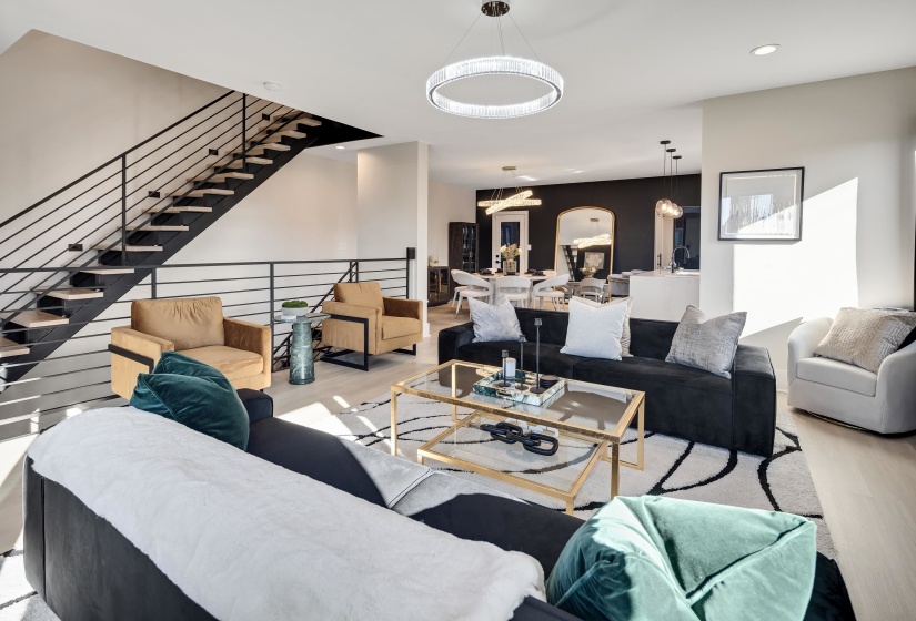 Living area with wood finished floors and recessed lighting