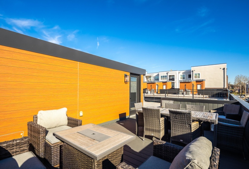 View of patio / terrace featuring outdoor dining space and a rooftop deck