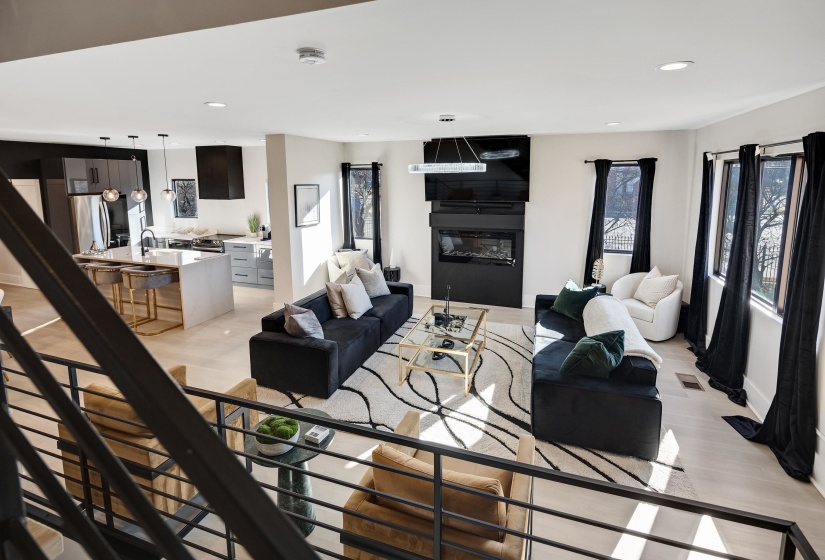Living room featuring recessed lighting and a fireplace
