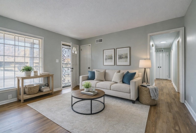 Living area featuring a textured ceiling and wood finished floors