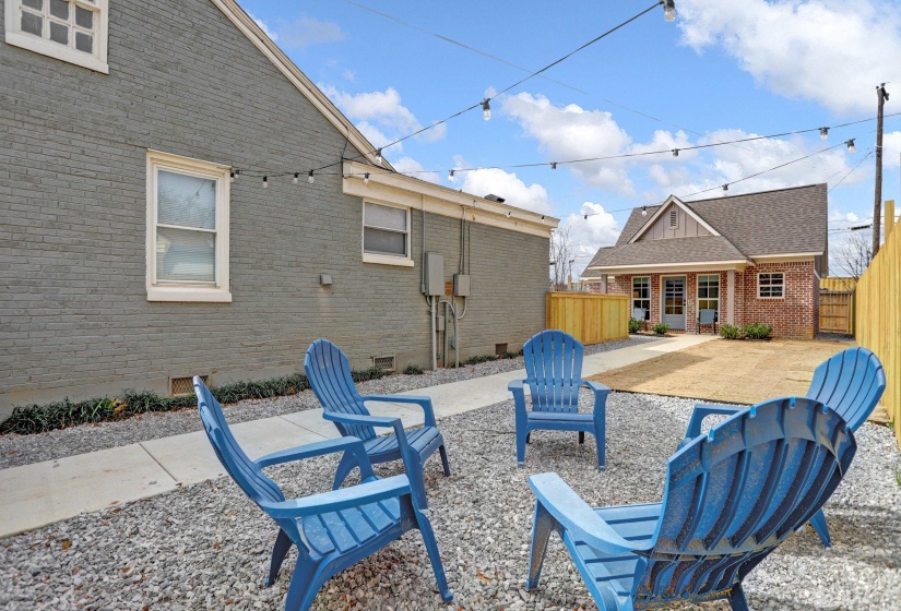 View of patio / terrace featuring an outbuilding and fence