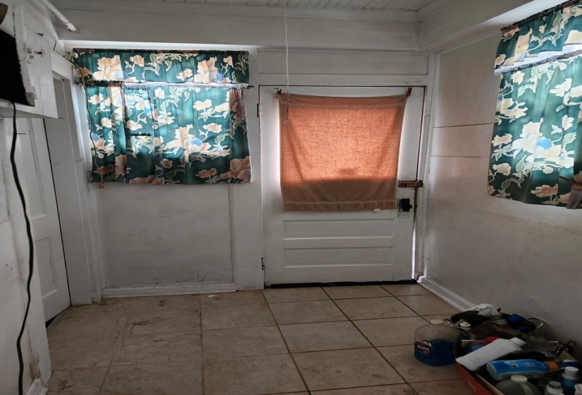 Doorway to outside with tile patterned floors