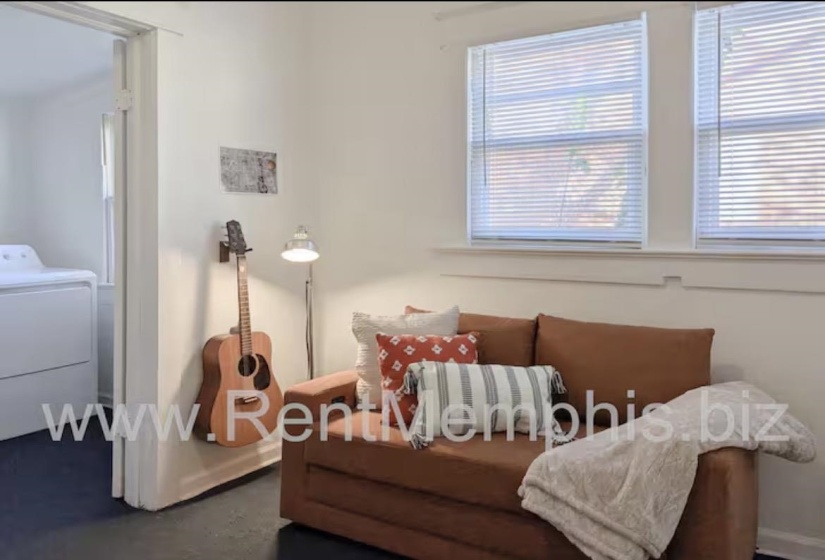 Living area featuring washer / clothes dryer