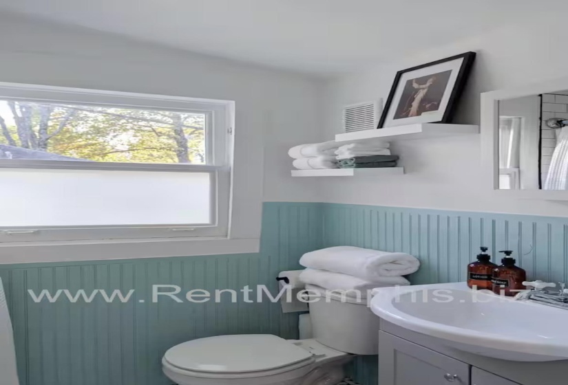 Bathroom featuring vanity and wainscoting