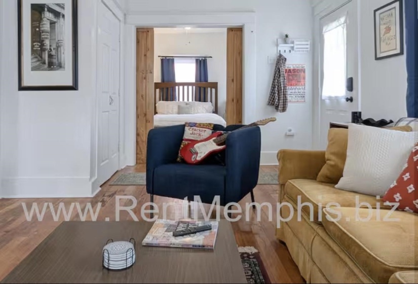 Living area featuring wood finished floors and baseboards