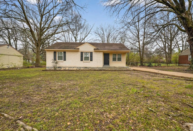 View of front of home with a front lawn and crawl space